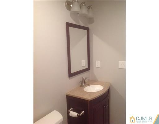 23 Colton Road Edison, NJ 08817 - Photo 10 of 12 a bathroom with a sink and a toilet