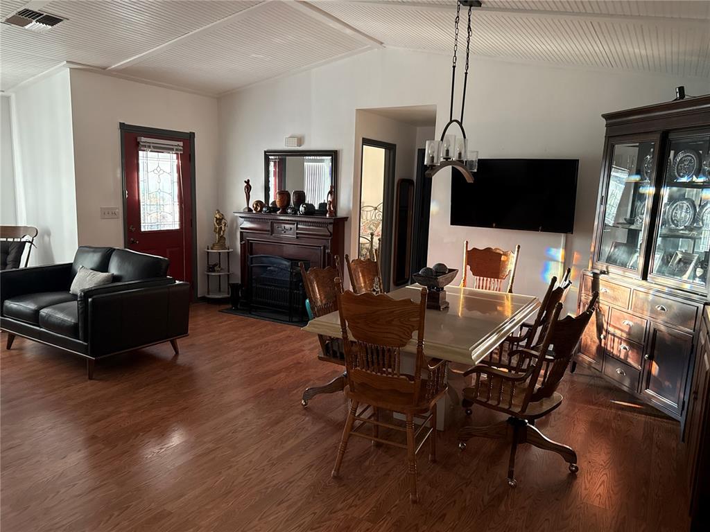 4560 Lamson Avenue Spring Hill, FL 34608 - Photo 12 of 41 a living room with furniture a flat screen tv and kitchen view