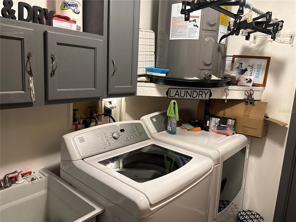 4560 Lamson Avenue Spring Hill, FL 34608 - Photo 14 of 41 a utility room with dryer and washer