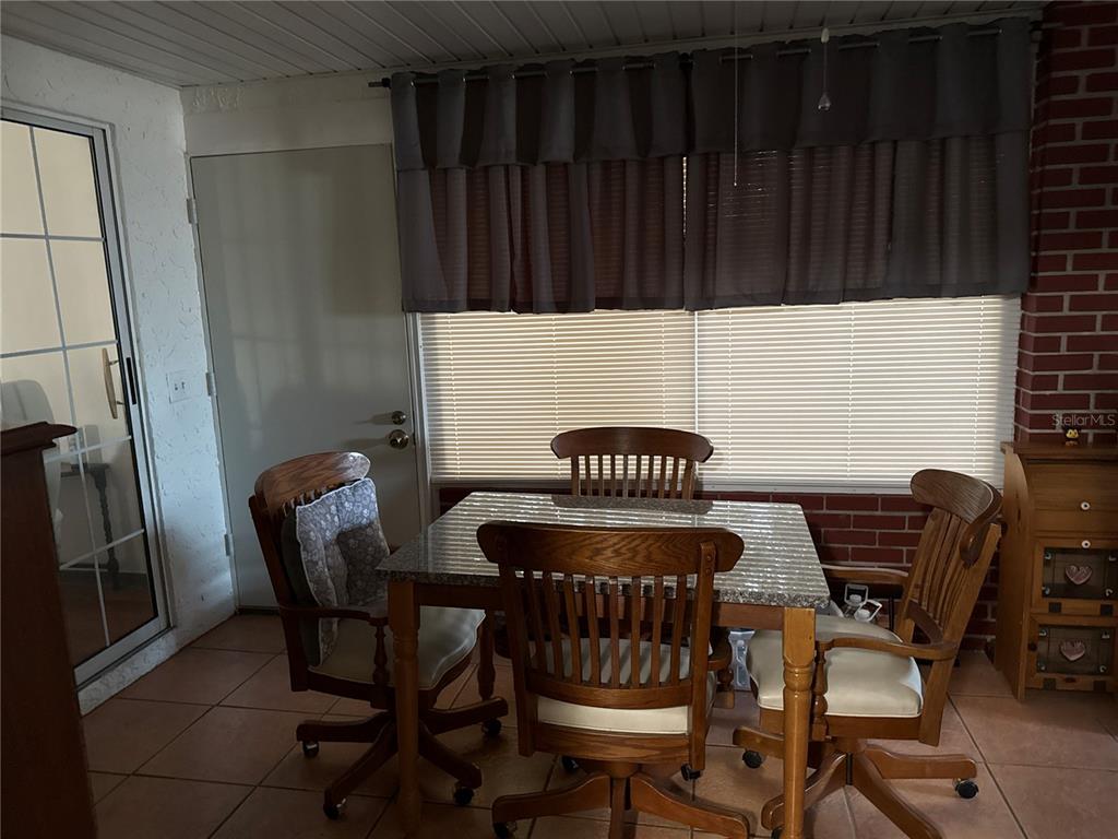 4560 Lamson Avenue Spring Hill, FL 34608 - Photo 26 of 41 a view of a chairs and table in the balcony