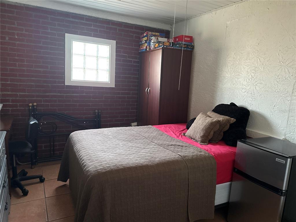 4560 Lamson Avenue Spring Hill, FL 34608 - Photo 29 of 41 a bedroom with a bed and a closet