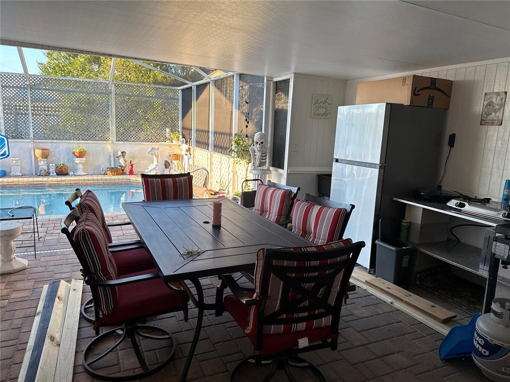 4560 Lamson Avenue Spring Hill, FL 34608 - Photo 34 of 41 a view of a dining room with furniture window and wooden floor