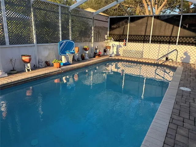 a view of swimming pool with chairs