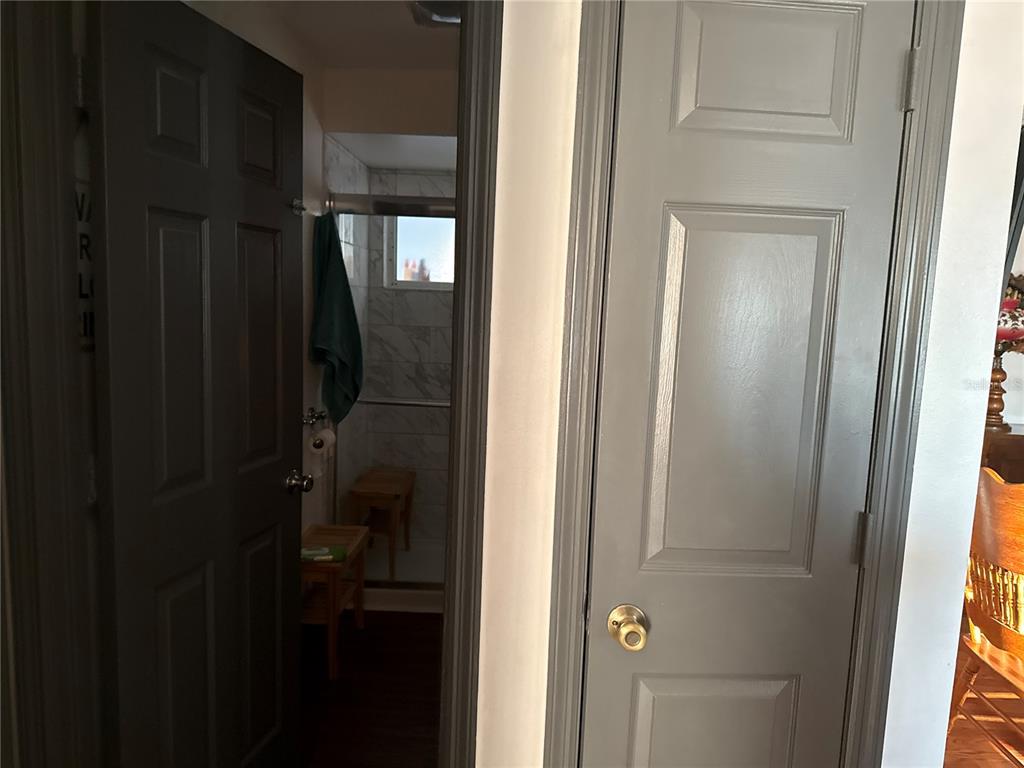 4560 Lamson Avenue Spring Hill, FL 34608 - Photo 4 of 41 a bathroom with a glass shower door