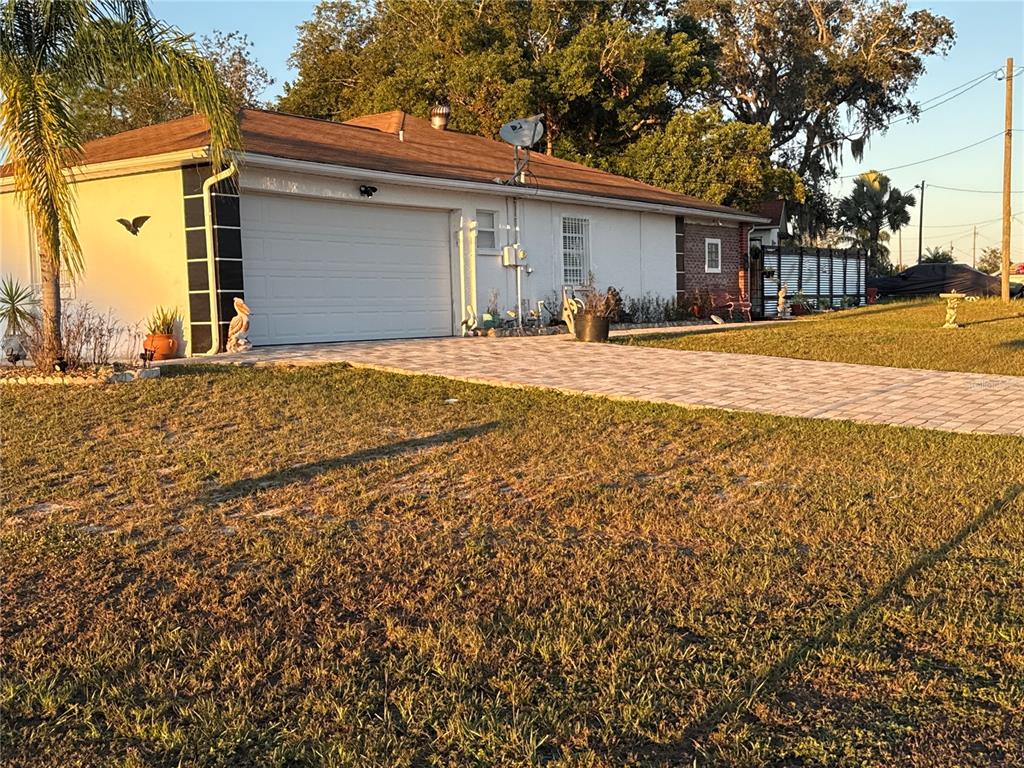4560 Lamson Avenue Spring Hill, FL 34608 - Photo 41 of 41 a front view of a house with a yard and garage