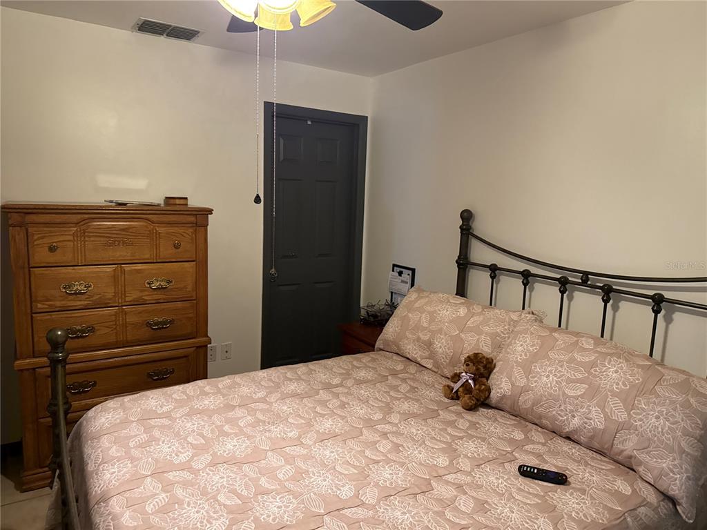 4560 Lamson Avenue Spring Hill, FL 34608 - Photo 9 of 41 a bed sitting in a bedroom and dresser