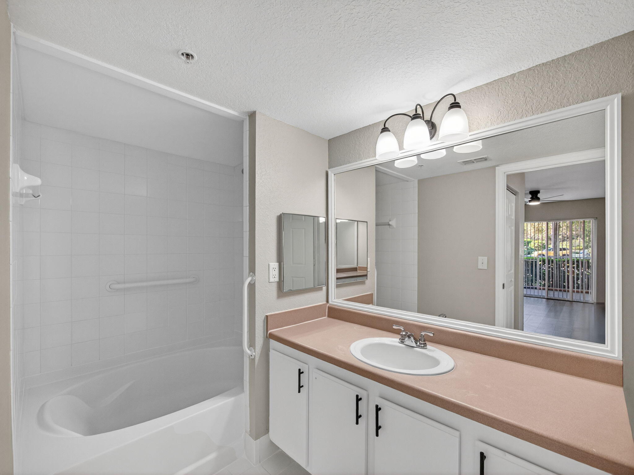 121 Southwest Palm Drive, Unit 107 Port St. Lucie, FL 34986 - Photo 11 of 15 a bathroom with a sink and a mirror