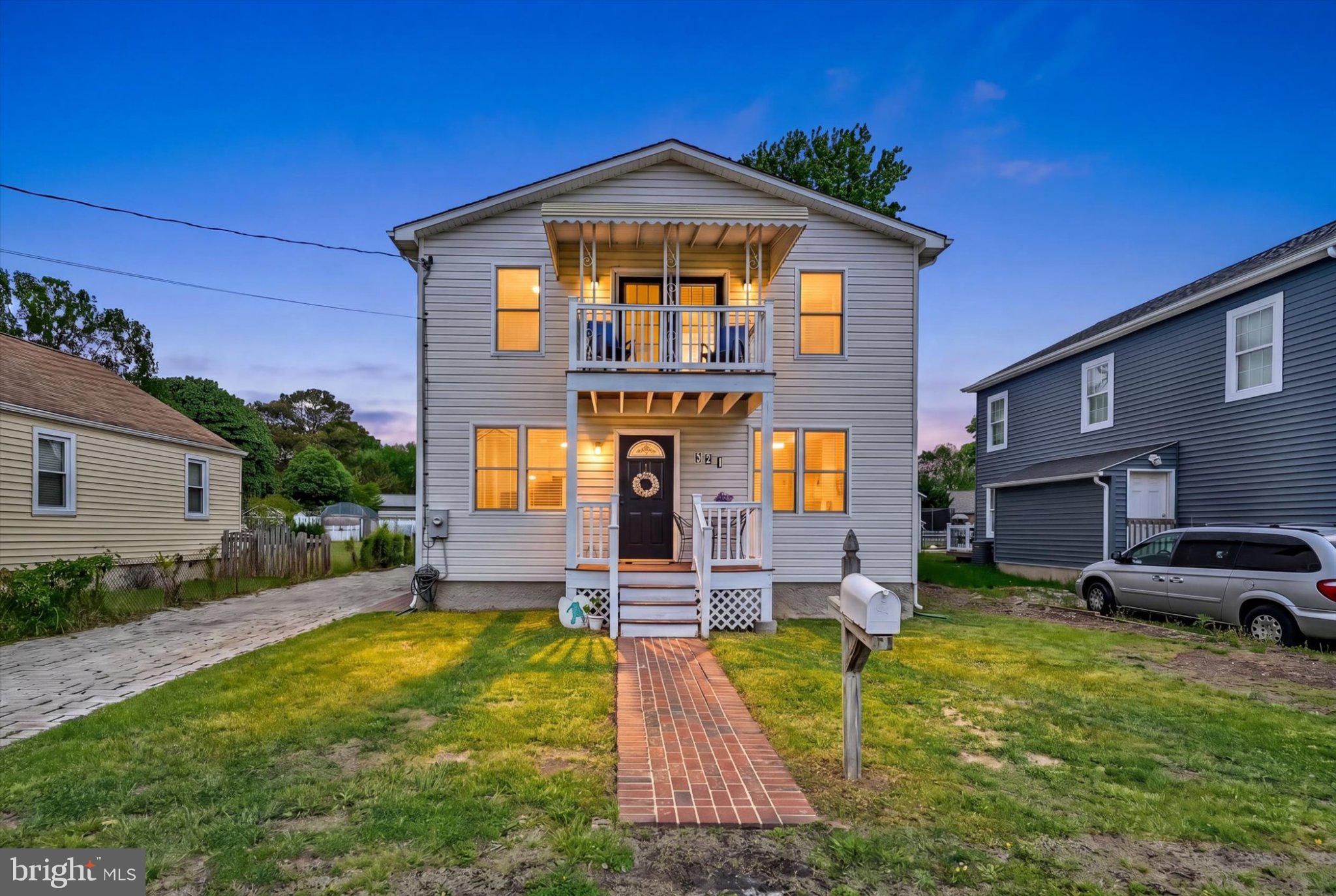 521 Riverside Drive Essex, MD 21221 - Photo 1 of 32 Charming two-story home at dusk.