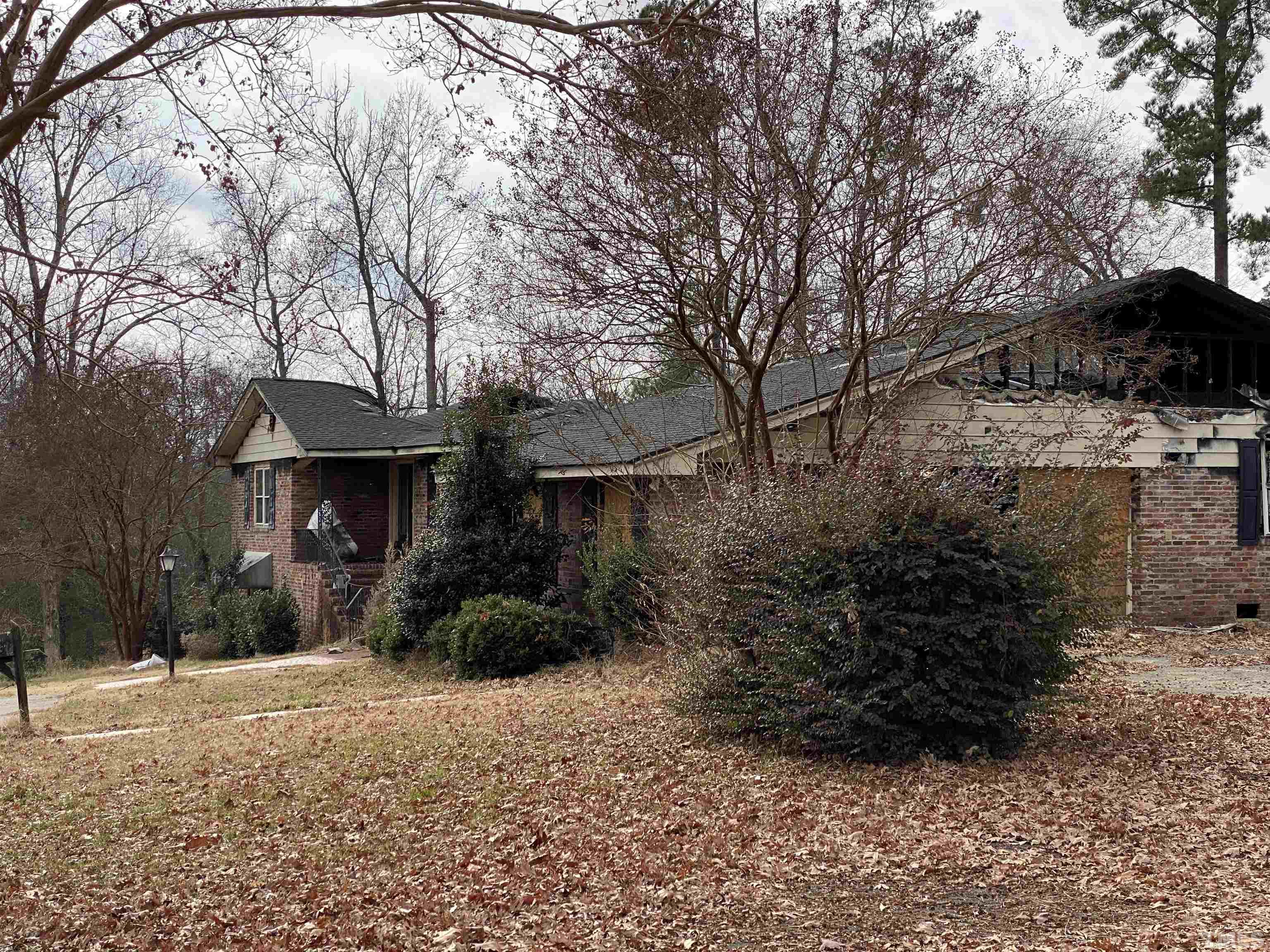 4208 Forestville Road Raleigh, NC 27616 - Photo 5 of 6 a front view of a house with a yard