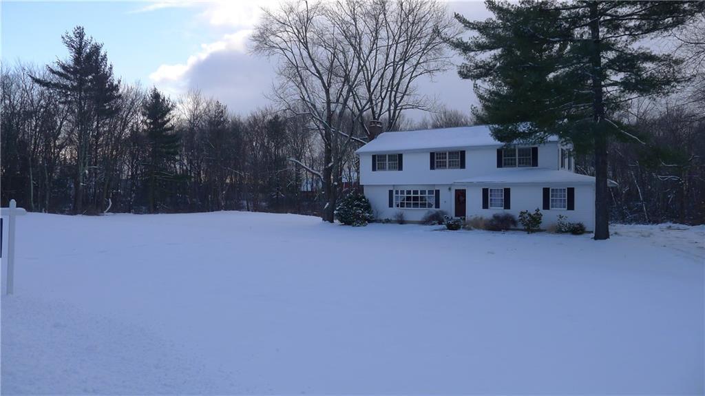 7 Bridle Trail Ridgefield, CT 06877 - Photo 1 of 1 a view of a house with a yard in the background