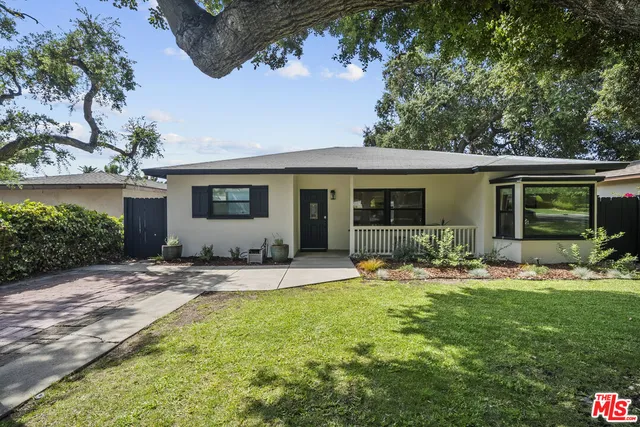a front view of house with yard and seating space