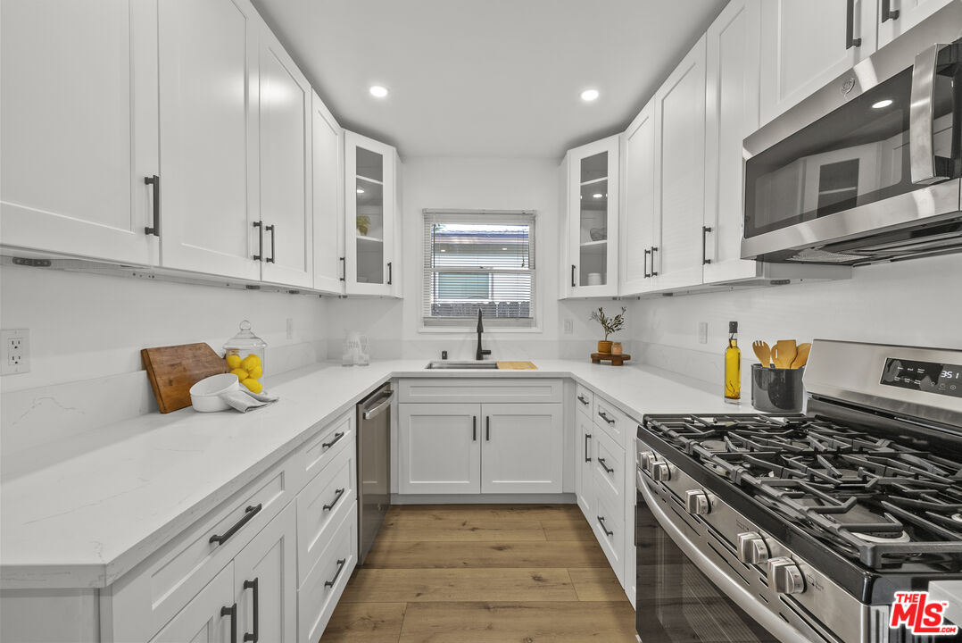 746 Valley View Avenue Monrovia, CA 91016 - Photo 13 of 53 a kitchen with stainless steel appliances granite countertop a stove and a sink