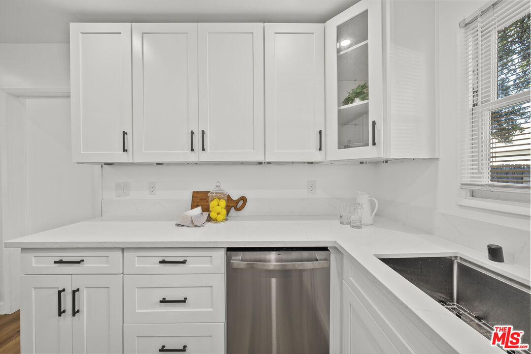 746 Valley View Avenue Monrovia, CA 91016 - Photo 14 of 53 a kitchen with stainless steel appliances granite countertop white cabinets and a sink