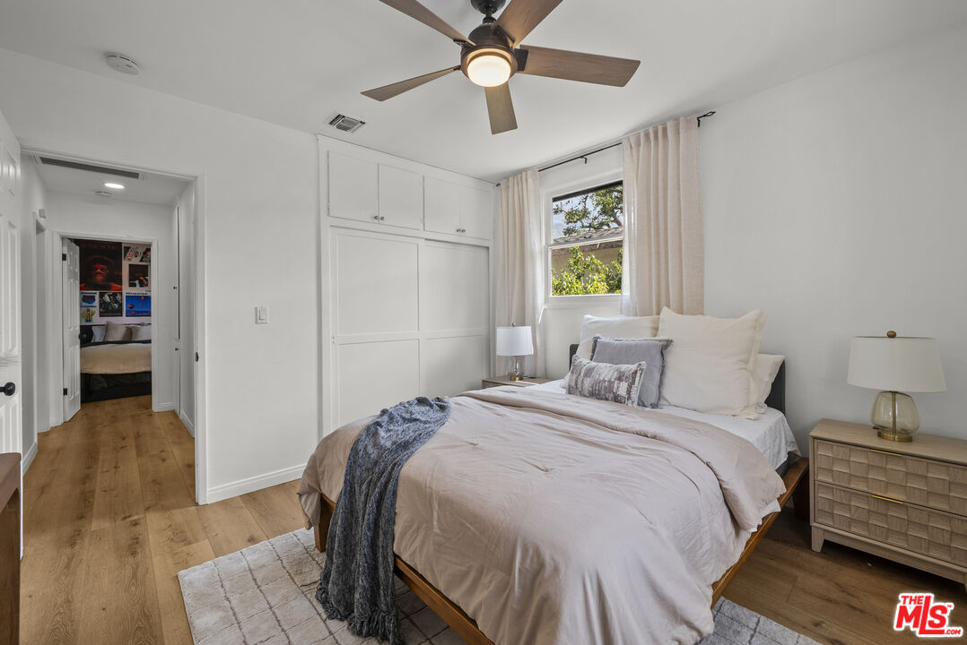 746 Valley View Avenue Monrovia, CA 91016 - Photo 18 of 53 a bedroom with a bed and a chandelier