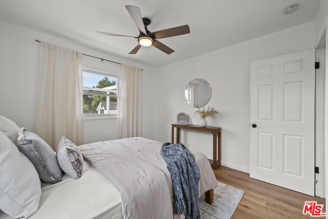 746 Valley View Avenue Monrovia, CA 91016 - Photo 20 of 53 a bedroom with a bed and a chandelier