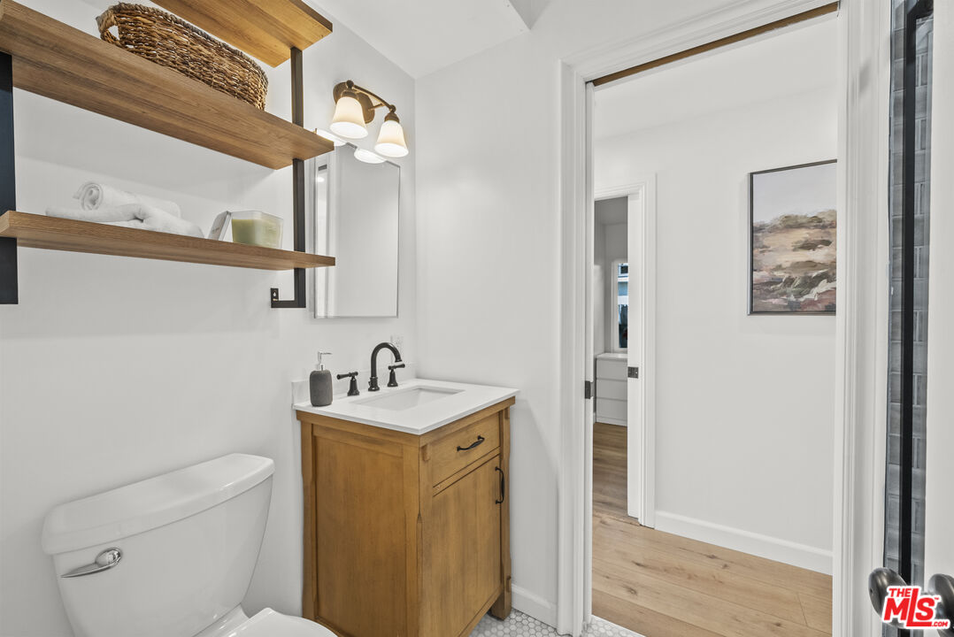 746 Valley View Avenue Monrovia, CA 91016 - Photo 23 of 53 a bathroom with a toilet a sink and a mirror