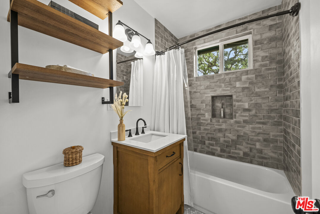 746 Valley View Avenue Monrovia, CA 91016 - Photo 27 of 53 a bathroom with a sink a toilet and shower