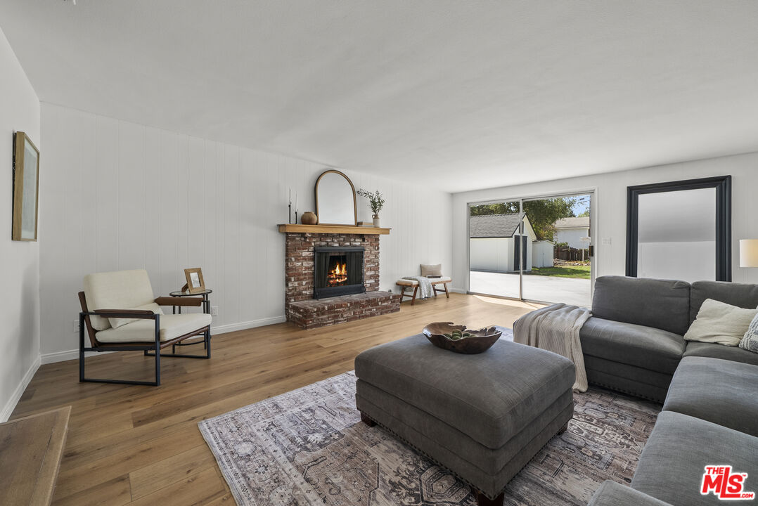 746 Valley View Avenue Monrovia, CA 91016 - Photo 32 of 53 a living room with furniture a rug and a fireplace