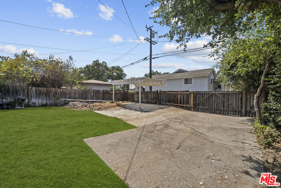 746 Valley View Avenue Monrovia, CA 91016 - Photo 42 of 53 a view of a backyard with brick wall and a large tree