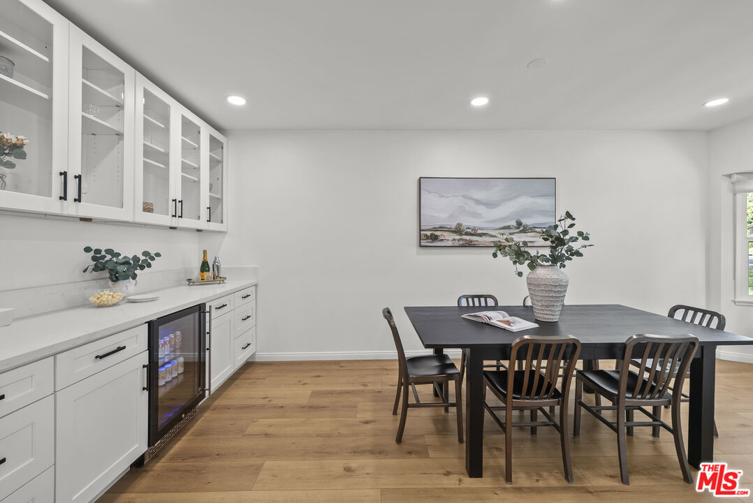 746 Valley View Avenue Monrovia, CA 91016 - Photo 8 of 53 a kitchen with stainless steel appliances kitchen island granite countertop a table and chairs in it