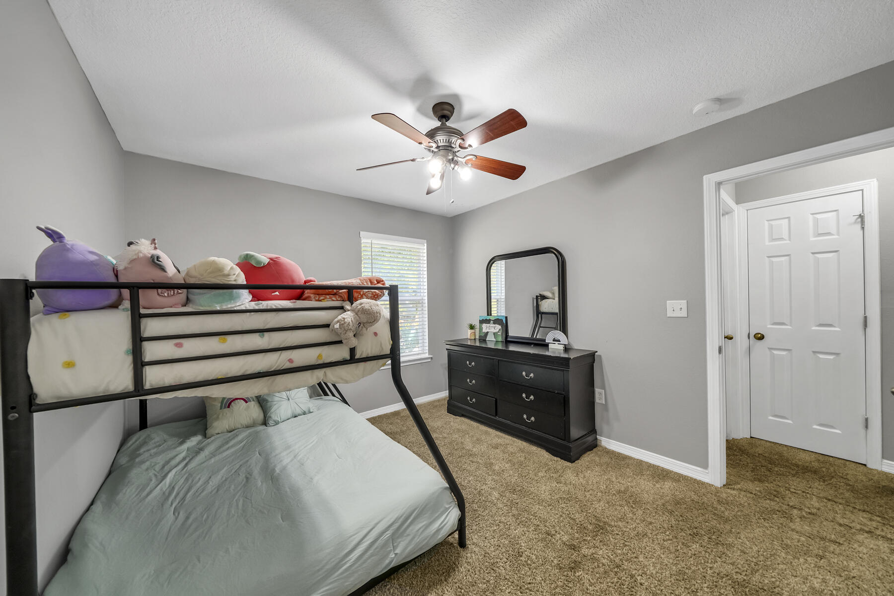 1705 North Pearl Street Crestview, FL 32536 - Photo 18 of 23 a bedroom with a bed and a chandelier