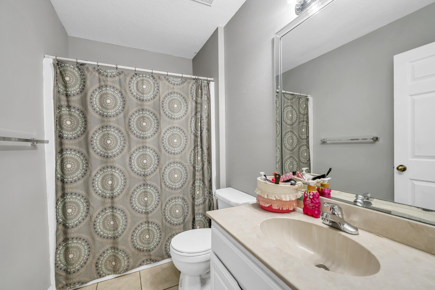 1705 North Pearl Street Crestview, FL 32536 - Photo 19 of 23 a bathroom with a sink and a mirror