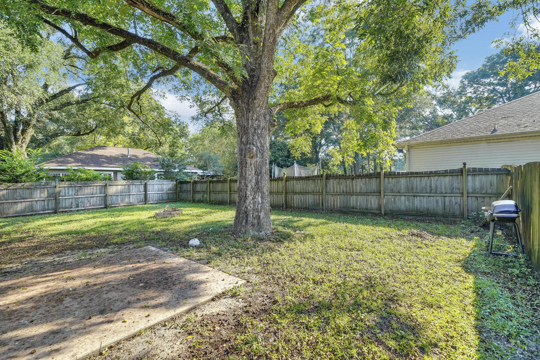 1705 North Pearl Street Crestview, FL 32536 - Photo 21 of 23 a view of a yard with a trampoline