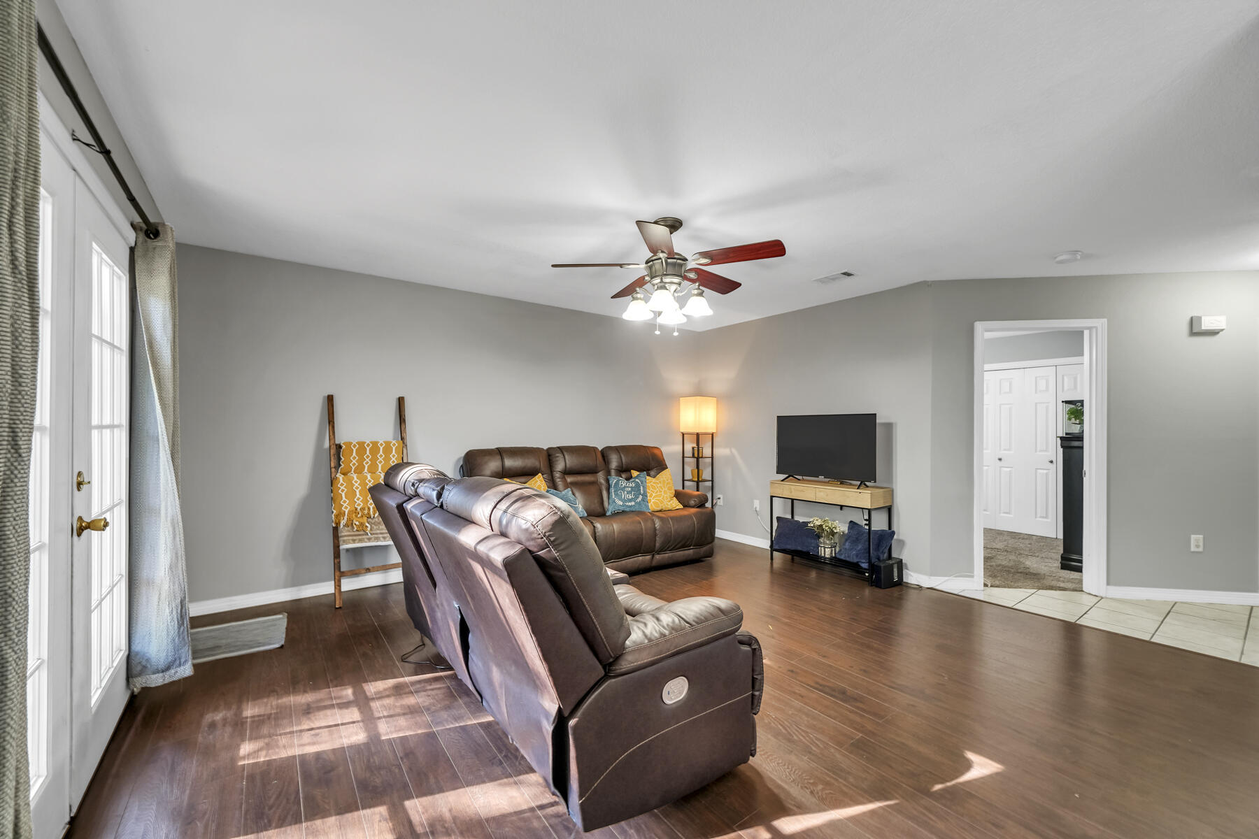 1705 North Pearl Street Crestview, FL 32536 - Photo 5 of 23 a living room with furniture and a flat screen tv