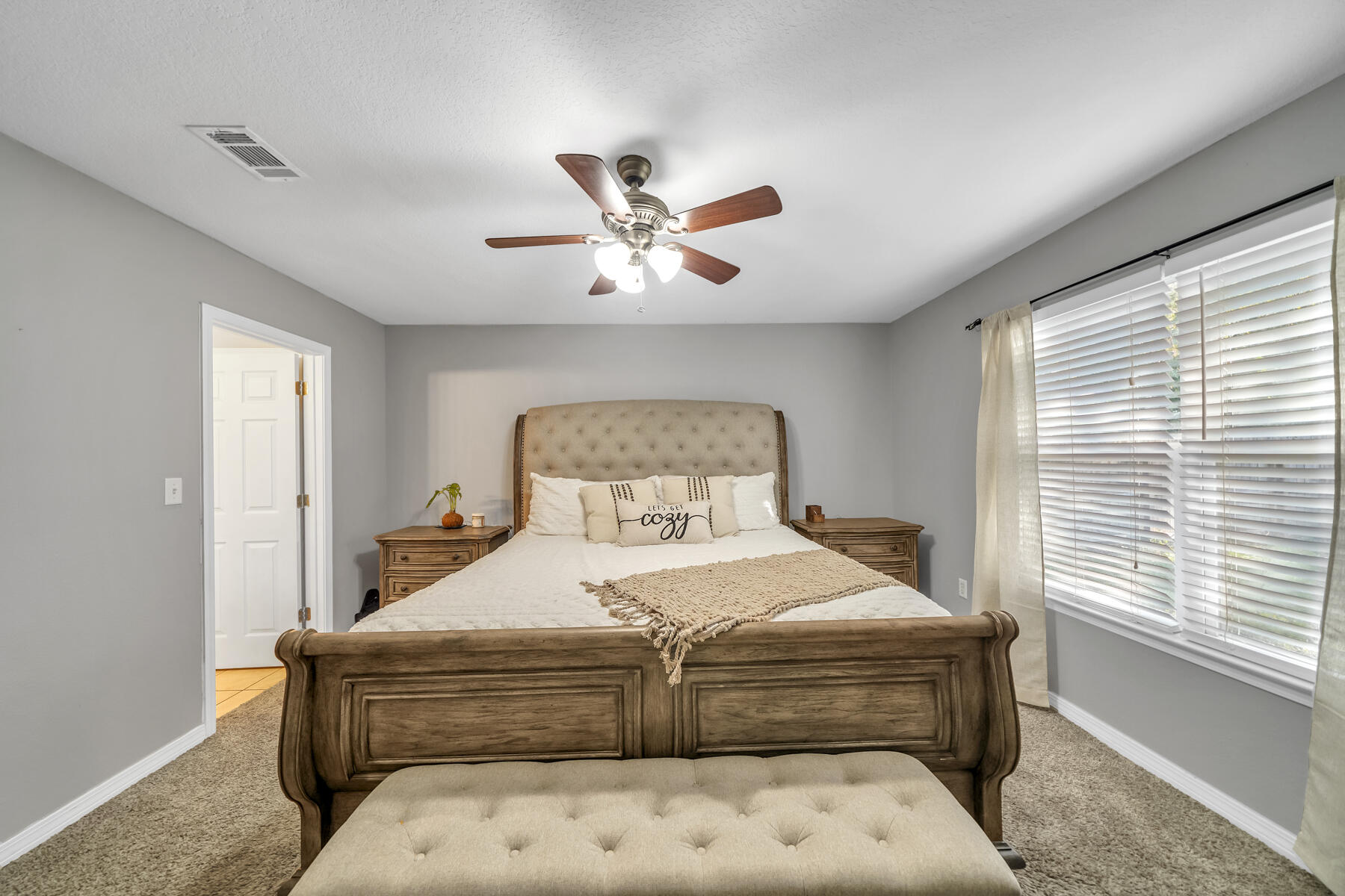 1705 North Pearl Street Crestview, FL 32536 - Photo 10 of 23 a bedroom with a large bed and a large window