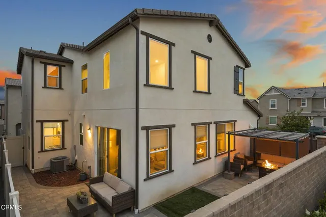 a front view of a house with many windows