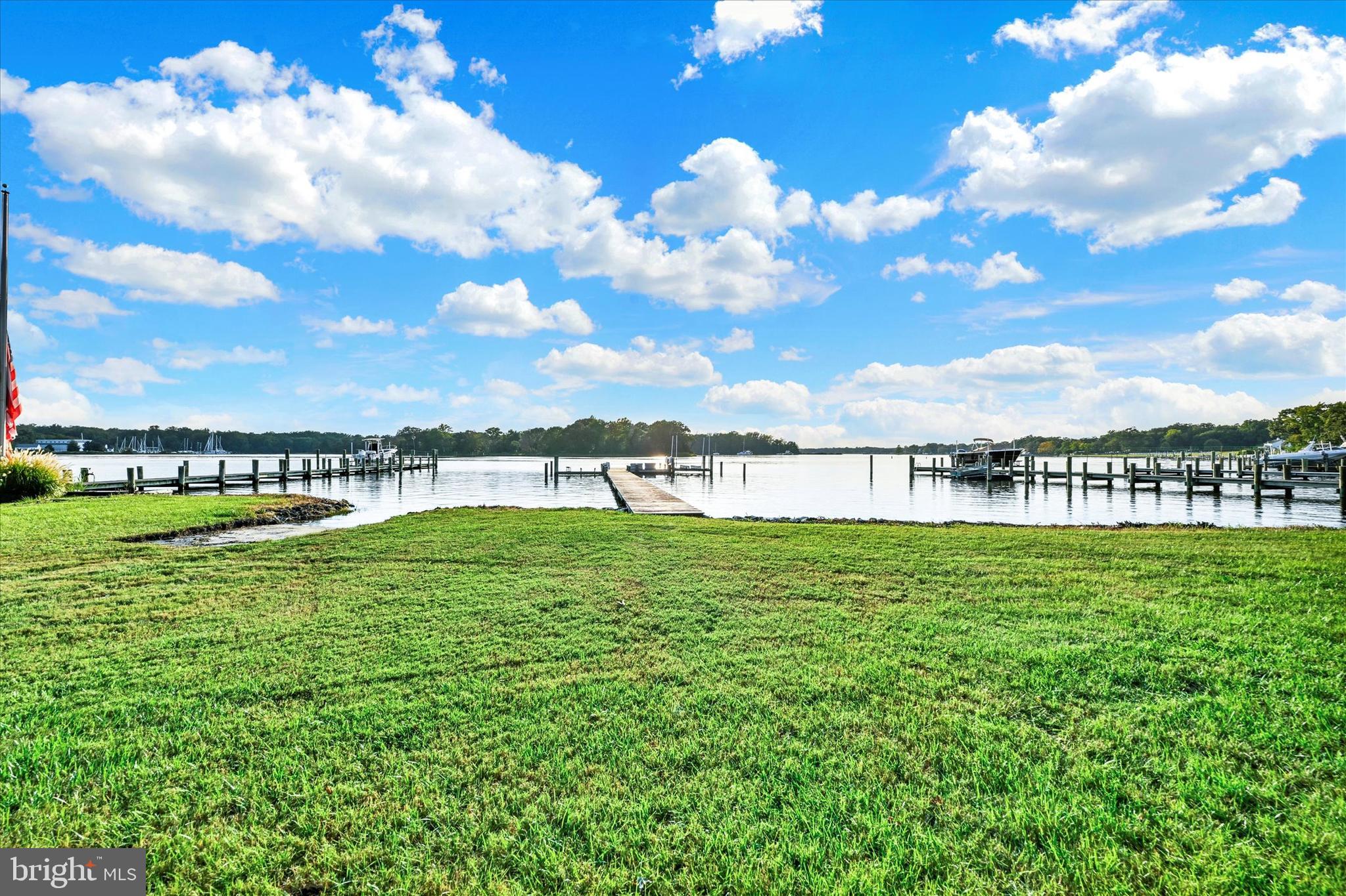 a view of a lake with houses in the back