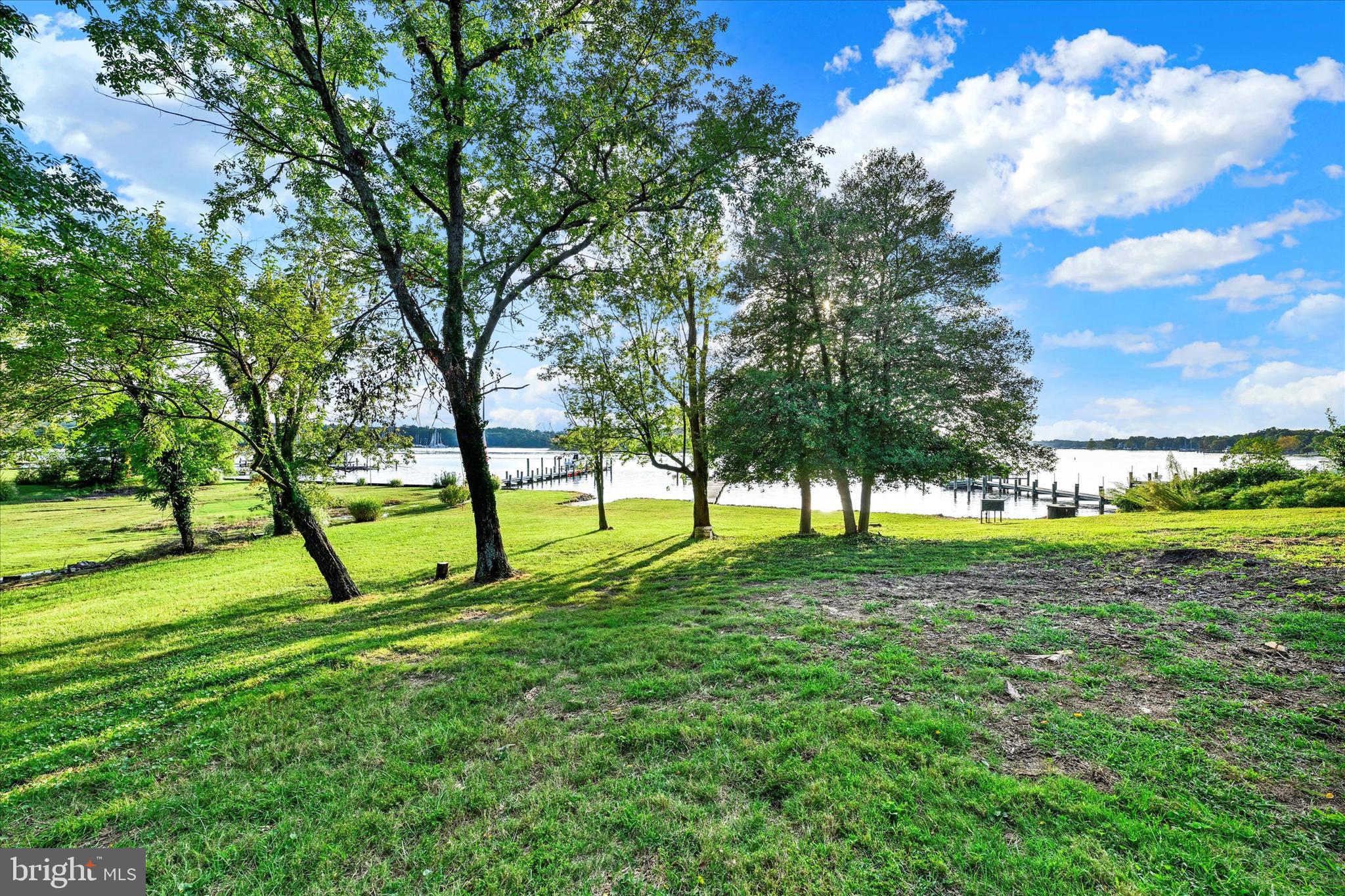 5169 Mountain Road Pasadena, MD 21122 - Photo 6 of 14 a huge green field with lots of trees