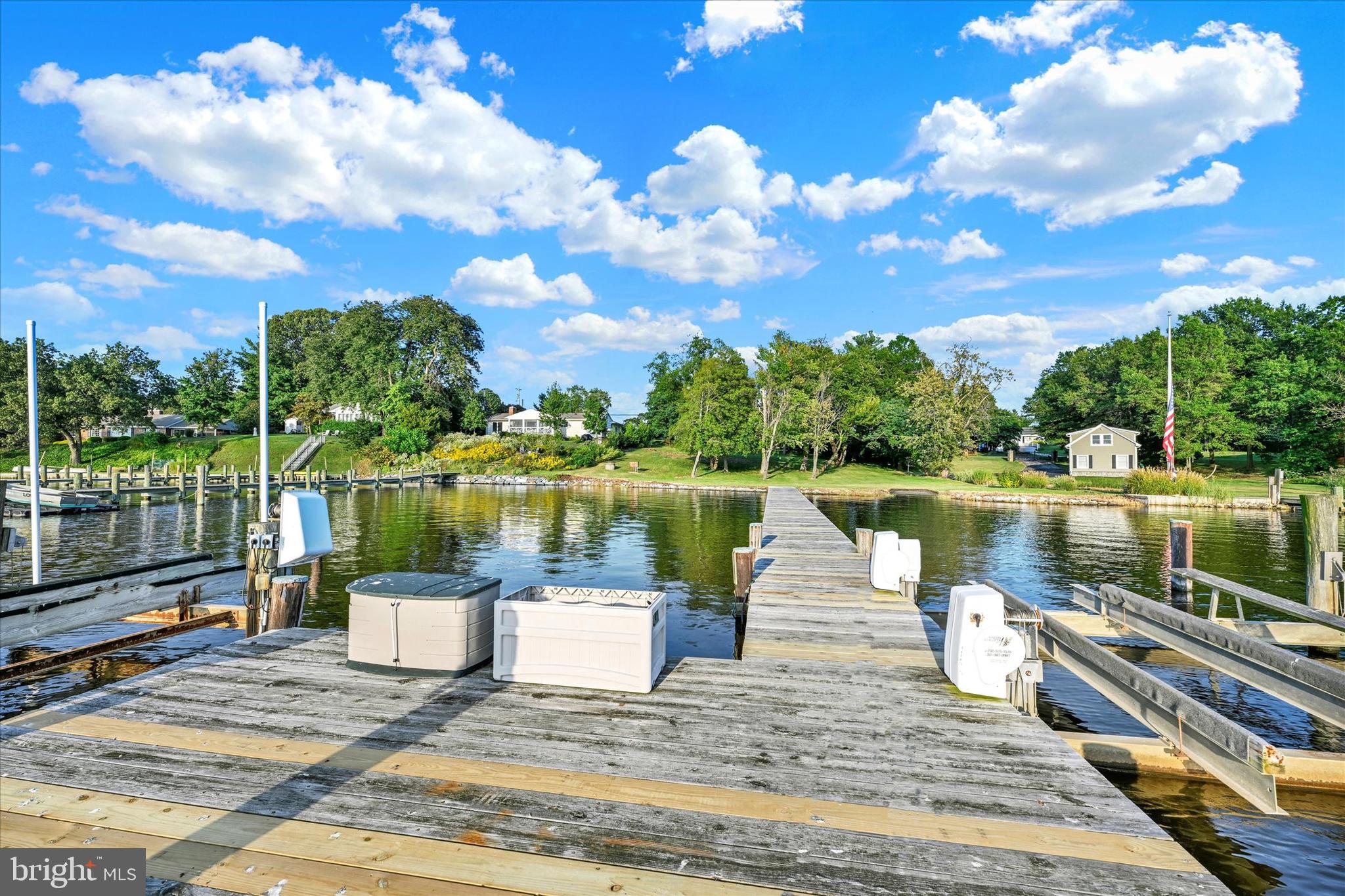 5169 Mountain Road Pasadena, MD 21122 - Photo 9 of 14 a view of a lake with a patio
