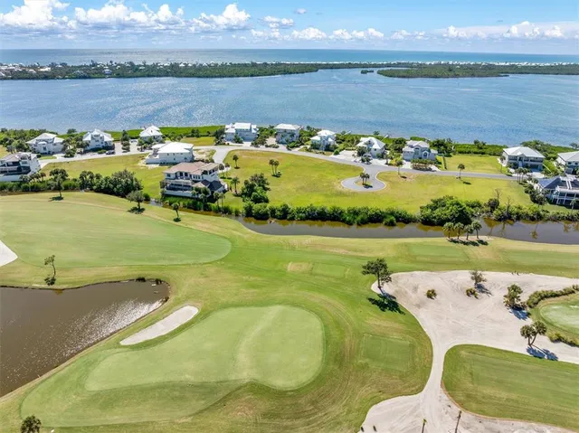 a view of a lake with a yard