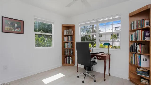a view of a workspace with bookshelf