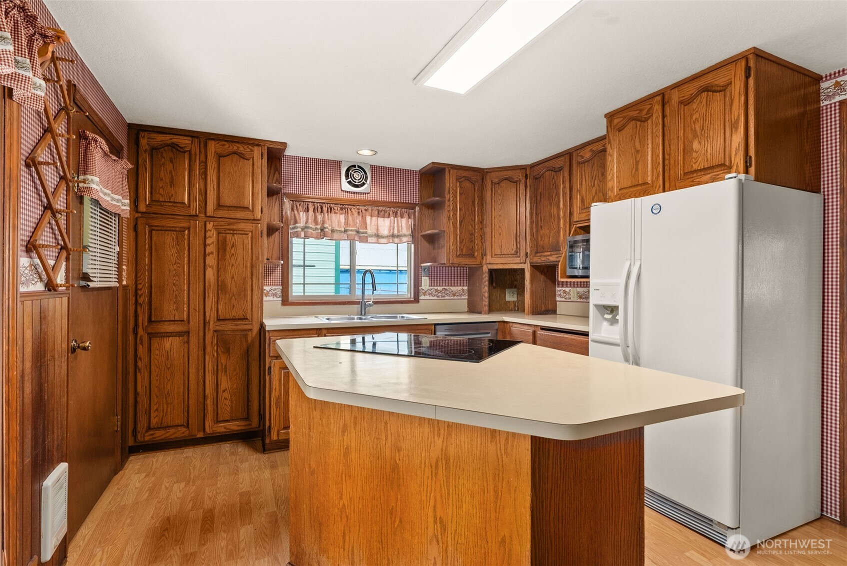 998 SR 6 Raymond, WA 98577 - Photo 11 of 38 a kitchen with stainless steel appliances granite countertop a refrigerator a stove and a sink