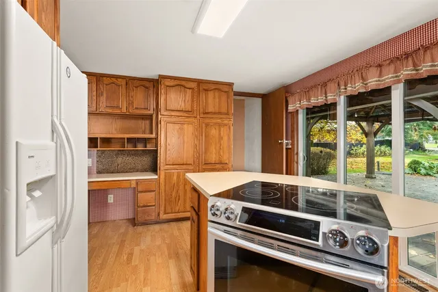 a kitchen that has a stove and a sink