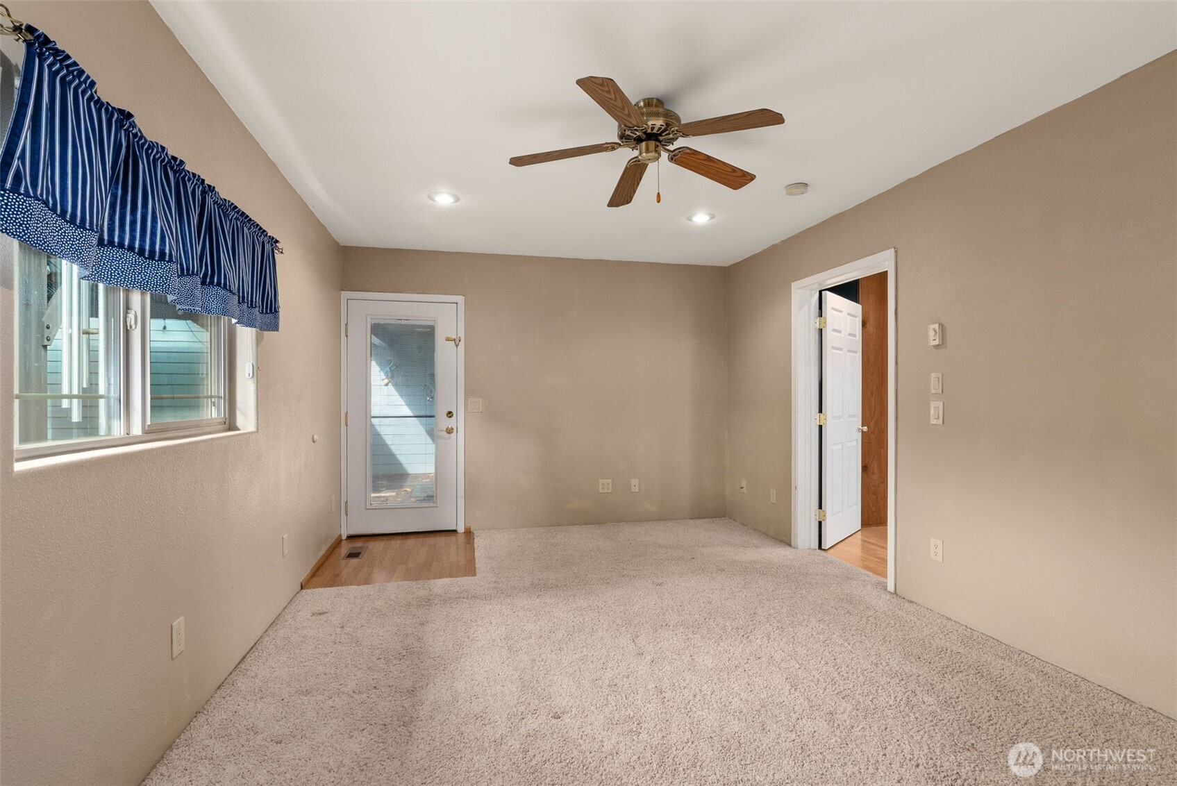 998 SR 6 Raymond, WA 98577 - Photo 14 of 40 a view of a livingroom with a ceiling fan and window