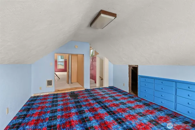 a view of a room with wooden walls