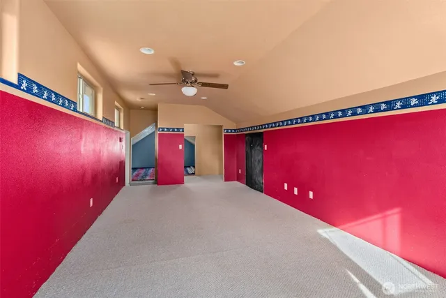 a view of a house with a big yard and sitting area