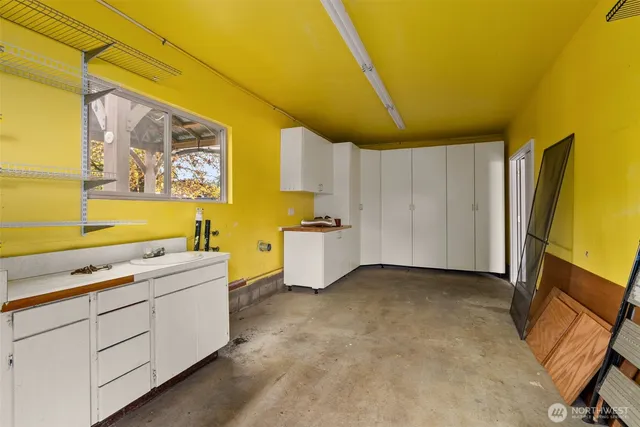 a view of house with entryway and wooden walls