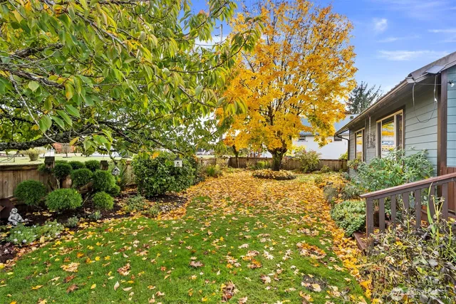 a front view of house with wooden fence