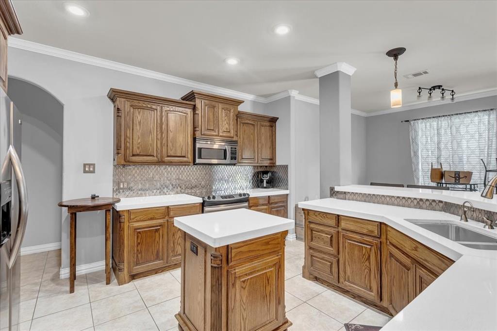 3707 Sumner Court Sherman, TX 75090 - Photo 12 of 34 a kitchen that has a sink and a stove in it