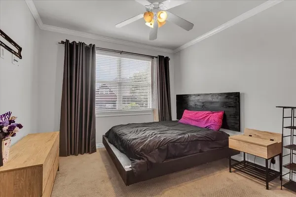 a bathroom with a sink a toilet and a large mirror