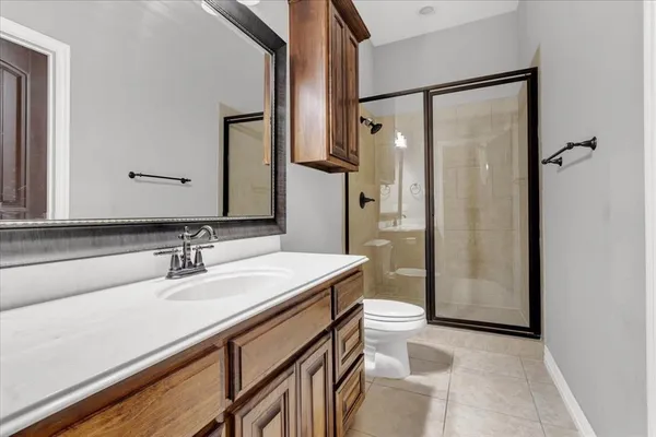 a view of a big house with a big yard and potted plants