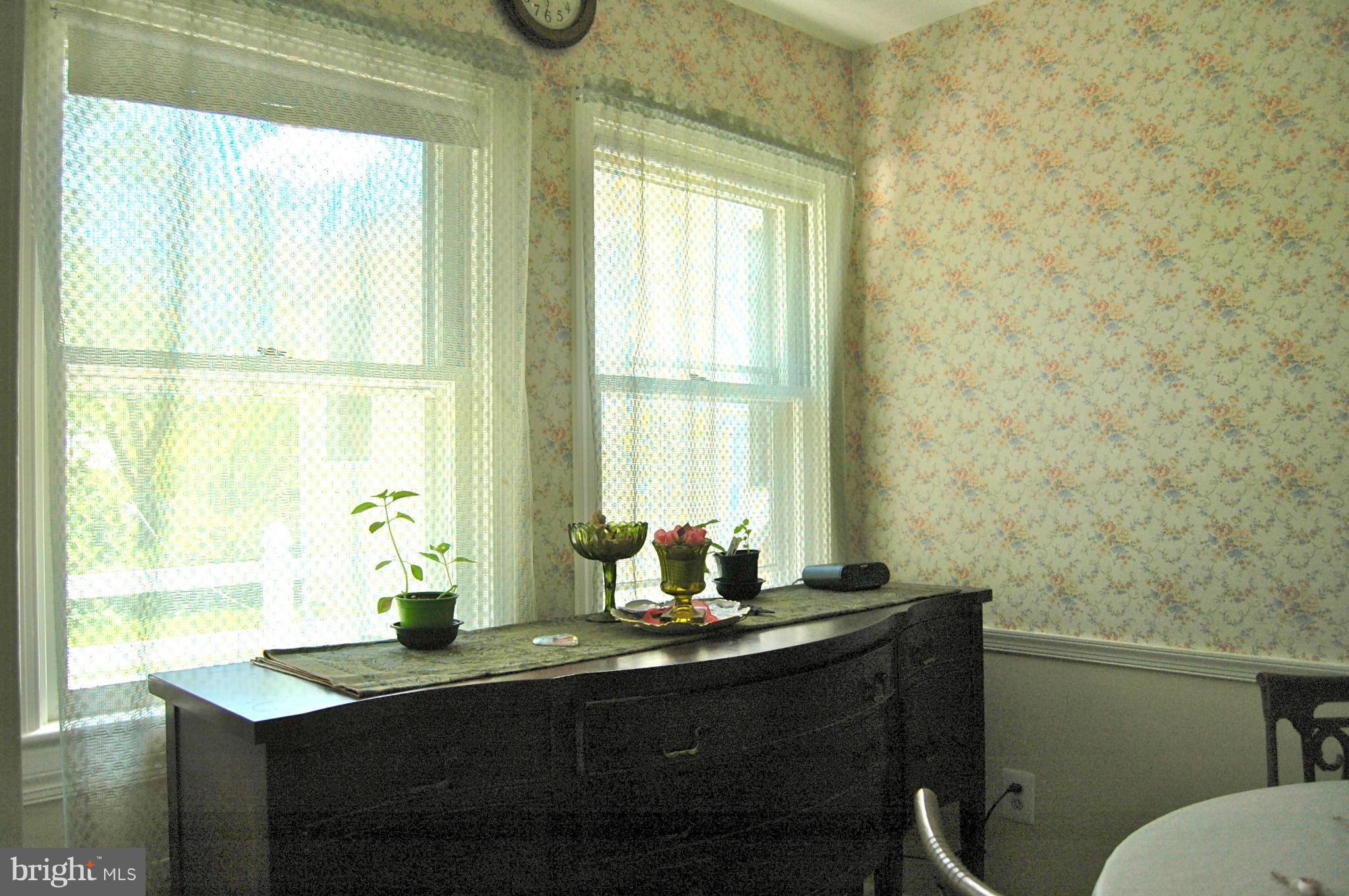 3517 Ellen Road Windsor Mill, MD 21244 - Photo 15 of 30 a bathroom with a granite countertop sink and a window