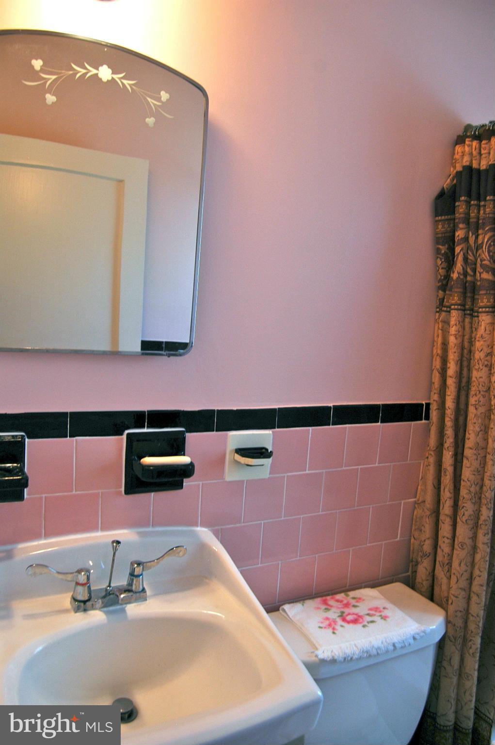 3517 Ellen Road Windsor Mill, MD 21244 - Photo 25 of 30 a bathroom with a sink and a mirror