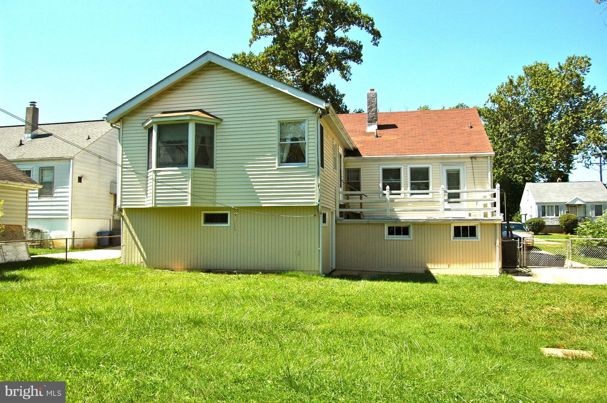 3517 Ellen Road Windsor Mill, MD 21244 - Photo 29 of 30 a front view of a house with a garden and yard