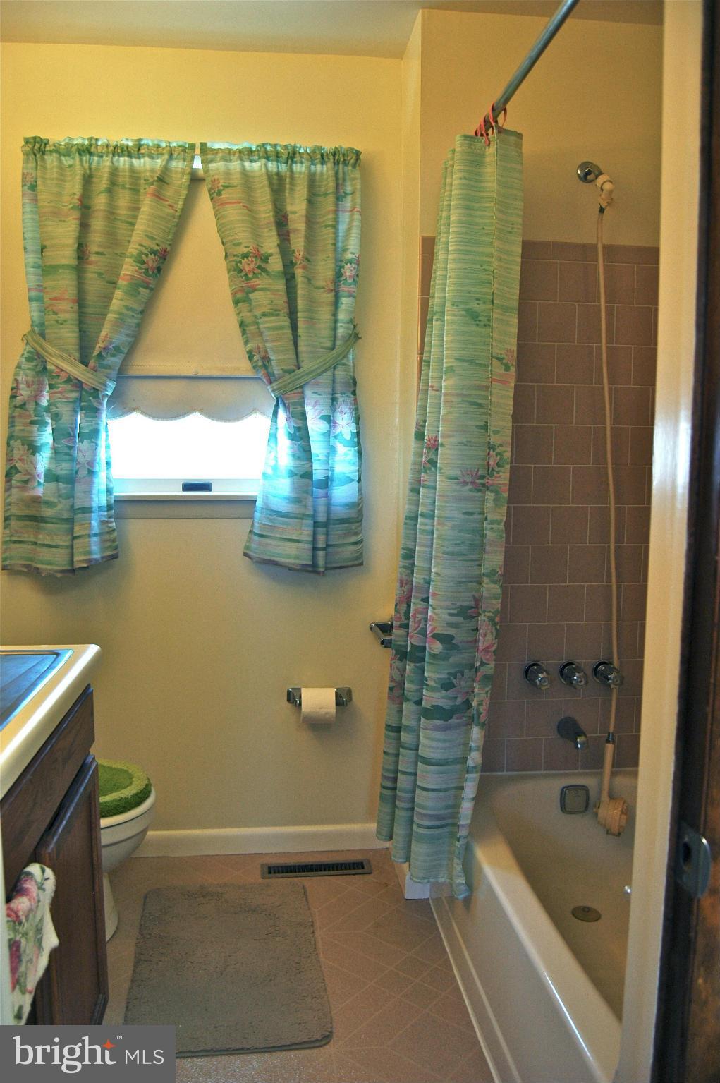 3517 Ellen Road Windsor Mill, MD 21244 - Photo 4 of 30 a bathroom with a bathtub and shower
