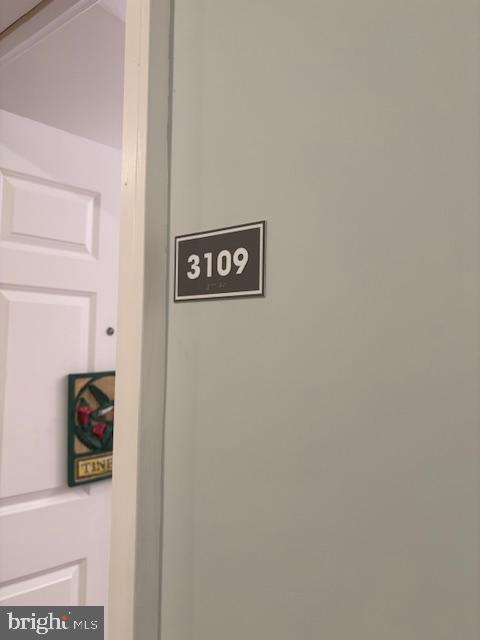 30609 Cedar Neck Road, Unit 3109 Ocean View, DE 19970 - Photo 11 of 44 a wall with a refrigerator
